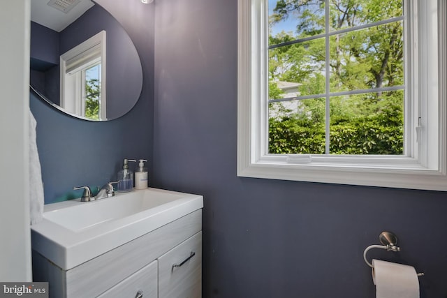 bathroom with visible vents and vanity