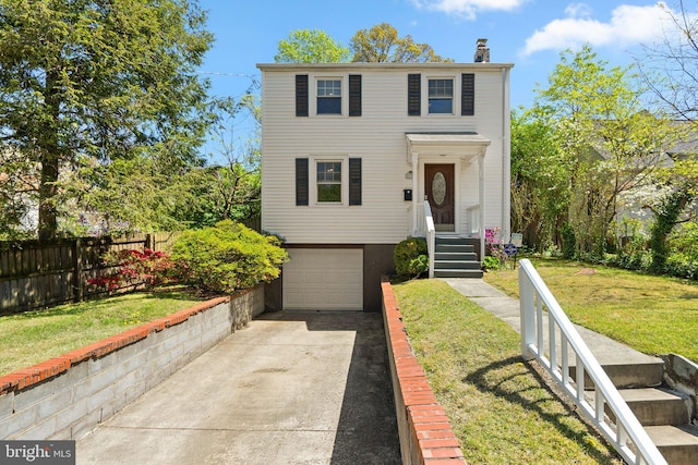 5803 41st Ave, Hyattsville, MD 20781 - view of front facade with driveway, a chimney, and an attached garage