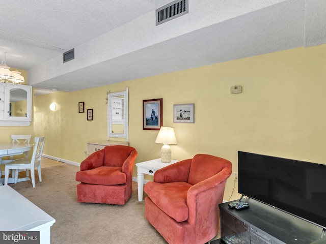 13400 Coastal Hwy Unit N405, Ocean City, MD 21842 - carpeted living room with baseboards, visible vents, and a textured ceiling