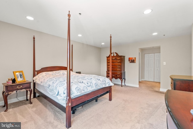 bedroom featuring baseboards, recessed lighting, and light carpet