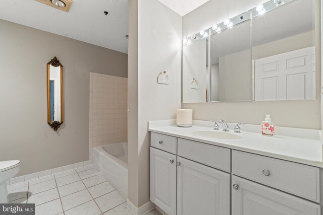 full bathroom with toilet, tile patterned flooring, vanity, and baseboards