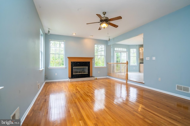 24 Chesapeake Rd, Monmouth Junction, NJ 08852 - unfurnished living room with visible vents, ceiling fan, light wood-style floors, and baseboards