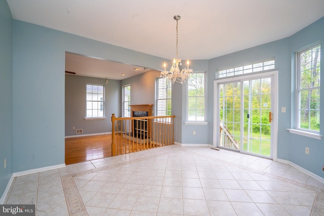 24 Chesapeake Rd, Monmouth Junction, NJ 08852 - unfurnished dining area featuring light tile patterned floors, a wealth of natural light, and baseboards