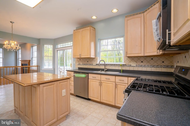 24 Chesapeake Rd, Monmouth Junction, NJ 08852 - kitchen featuring appliances with stainless steel finishes, light brown cabinets, a kitchen island, and a sink
