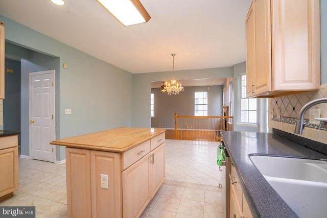 24 Chesapeake Rd, Monmouth Junction, NJ 08852 - kitchen featuring light brown cabinets, backsplash, a sink, a notable chandelier, and light tile patterned flooring