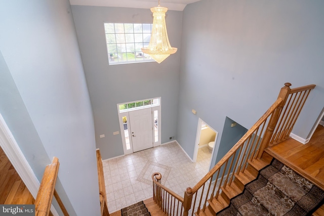 24 Chesapeake Rd, Monmouth Junction, NJ 08852 - entryway with baseboards, a wealth of natural light, and a high ceiling