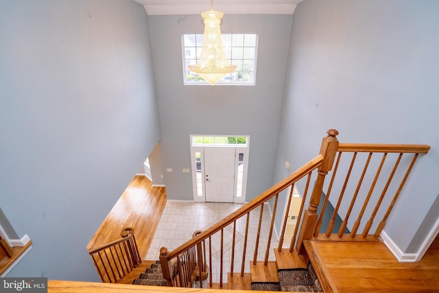 24 Chesapeake Rd, Monmouth Junction, NJ 08852 - foyer entrance with a healthy amount of sunlight, baseboards, and stairs