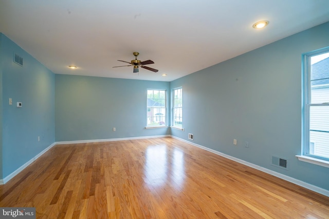24 Chesapeake Rd, Monmouth Junction, NJ 08852 - empty room with baseboards, visible vents, wood finished floors, and ceiling fan