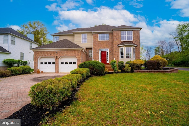 24 Chesapeake Rd, Monmouth Junction, NJ 08852 - traditional-style home with driveway, a front yard, brick siding, and an attached garage