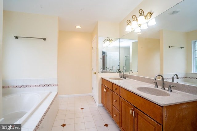 24 Chesapeake Rd, Monmouth Junction, NJ 08852 - full bathroom with tile patterned floors, a garden tub, double vanity, and a sink