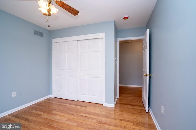 24 Chesapeake Rd, Monmouth Junction, NJ 08852 - unfurnished bedroom with a closet, light wood-type flooring, baseboards, visible vents, and a ceiling fan