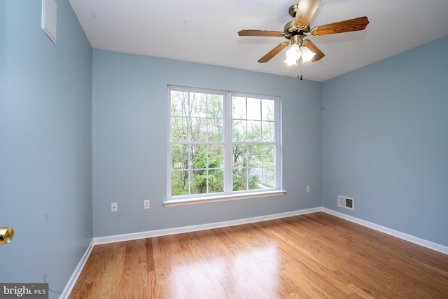24 Chesapeake Rd, Monmouth Junction, NJ 08852 - empty room with visible vents, ceiling fan, wood finished floors, and baseboards