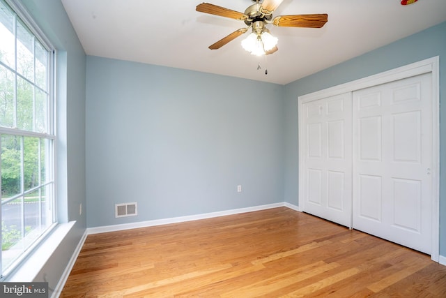 24 Chesapeake Rd, Monmouth Junction, NJ 08852 - unfurnished bedroom with baseboards, visible vents, a closet, and light wood finished floors