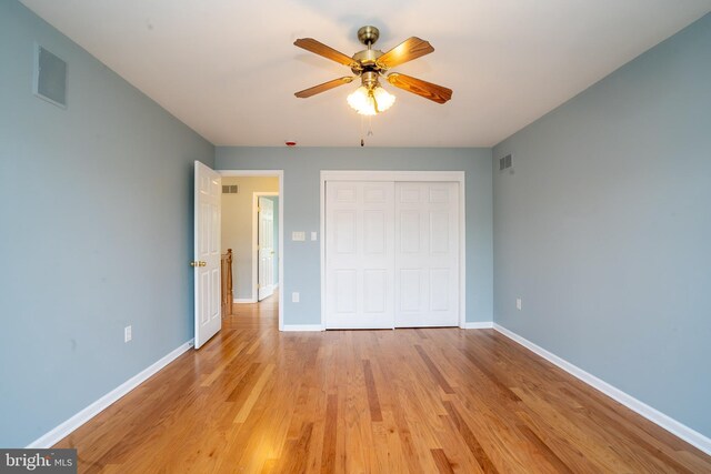 24 Chesapeake Rd, Monmouth Junction, NJ 08852 - unfurnished bedroom with visible vents, a closet, ceiling fan, baseboards, and light wood-type flooring