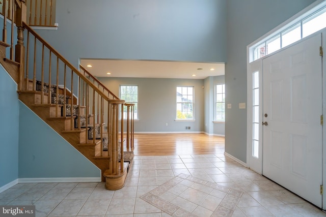 24 Chesapeake Rd, Monmouth Junction, NJ 08852 - entryway with a towering ceiling, stairway, and baseboards