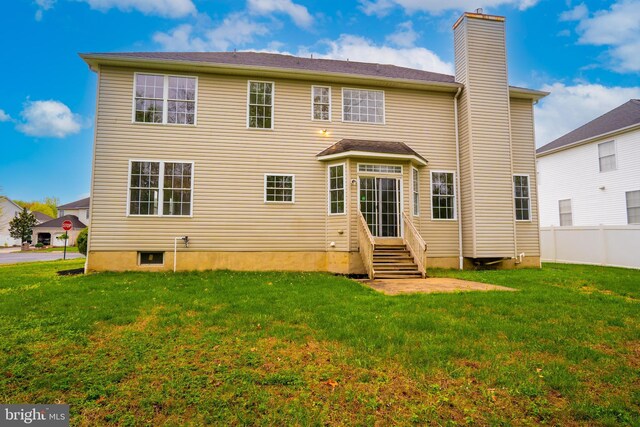 24 Chesapeake Rd, Monmouth Junction, NJ 08852 - rear view of house featuring a chimney, fence, entry steps, and a yard