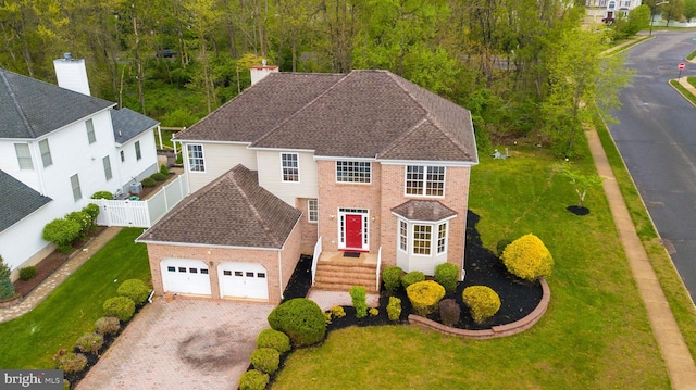24 Chesapeake Rd, Monmouth Junction, NJ 08852 - view of front facade featuring a front lawn, a garage, driveway, brick siding, and fence