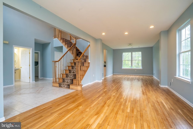 24 Chesapeake Rd, Monmouth Junction, NJ 08852 - unfurnished living room with recessed lighting, stairs, hardwood / wood-style floors, and baseboards
