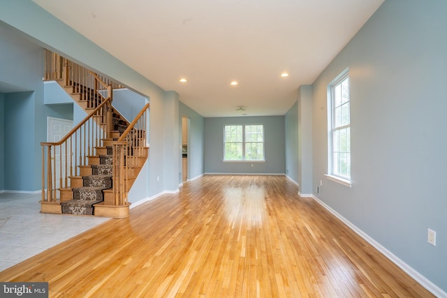 24 Chesapeake Rd, Monmouth Junction, NJ 08852 - unfurnished living room with recessed lighting, stairway, hardwood / wood-style flooring, and baseboards