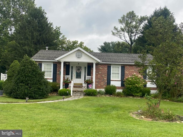 4 Hallbrook Ct, Baltimore, MD 21236 - view of front facade featuring covered porch, a front yard, and brick siding