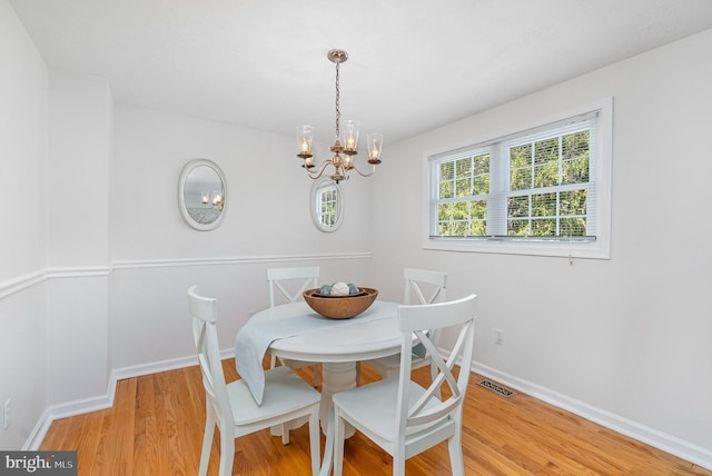 4 Hallbrook Ct, Baltimore, MD 21236 - dining room with light wood-style floors, baseboards, an inviting chandelier, and visible vents