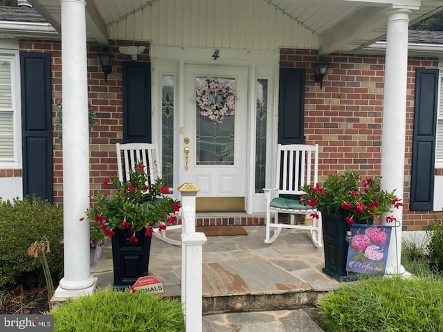 4 Hallbrook Ct, Baltimore, MD 21236 - property entrance featuring covered porch and brick siding