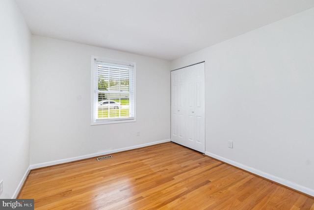 4 Hallbrook Ct, Baltimore, MD 21236 - unfurnished bedroom with a closet, baseboards, visible vents, and light wood-style floors