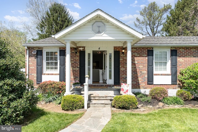 4 Hallbrook Ct, Baltimore, MD 21236 - view of front facade featuring a porch, brick siding, and roof with shingles