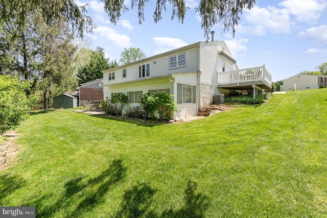 4 Hallbrook Ct, Baltimore, MD 21236 - rear view of house featuring a yard, cooling unit, a wooden deck, and an outbuilding