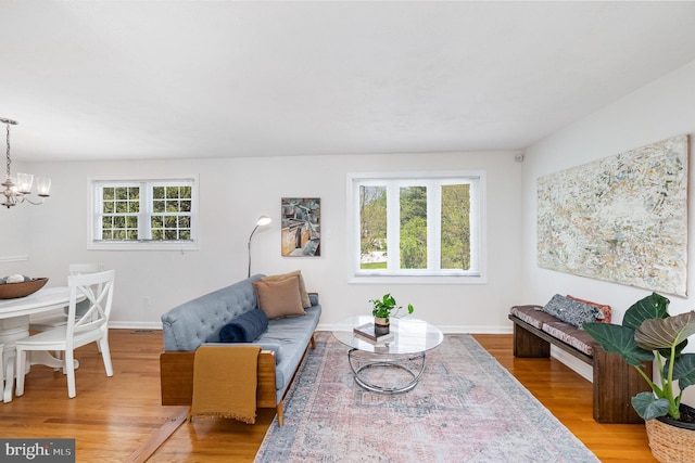 4 Hallbrook Ct, Baltimore, MD 21236 - living room with an inviting chandelier, baseboards, and wood finished floors