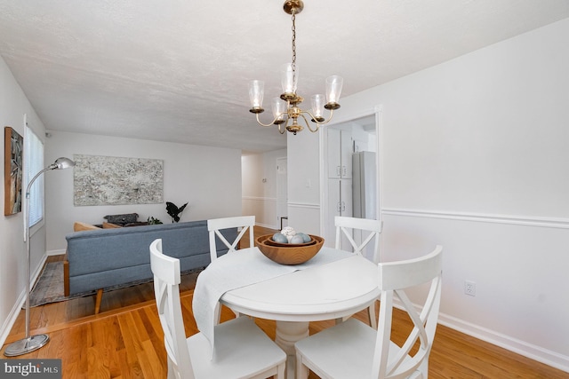 4 Hallbrook Ct, Baltimore, MD 21236 - dining area with baseboards, a chandelier, and light wood-style flooring