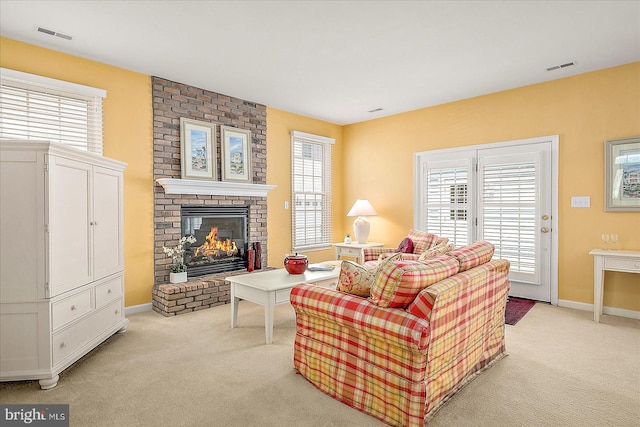 12139 Snug Harbor Rd, Berlin, MD 21811 - living area featuring a fireplace, visible vents, and light carpet