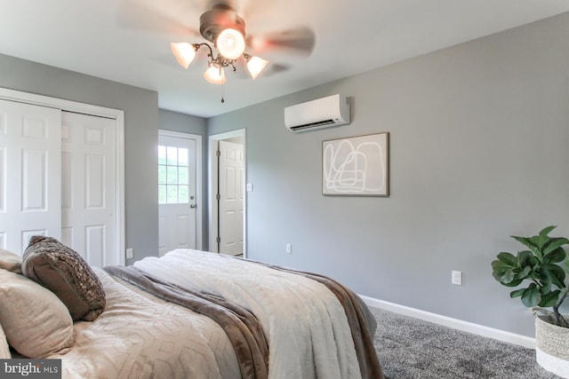 carpeted bedroom with ceiling fan, a closet, a wall mounted air conditioner, and baseboards