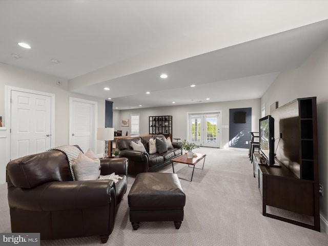 living room with recessed lighting and light colored carpet