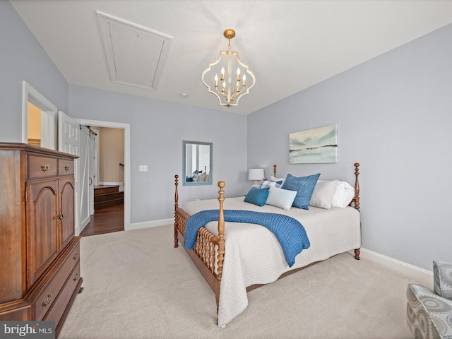 bedroom with baseboards, attic access, and light carpet