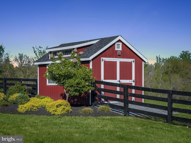 view of shed with fence