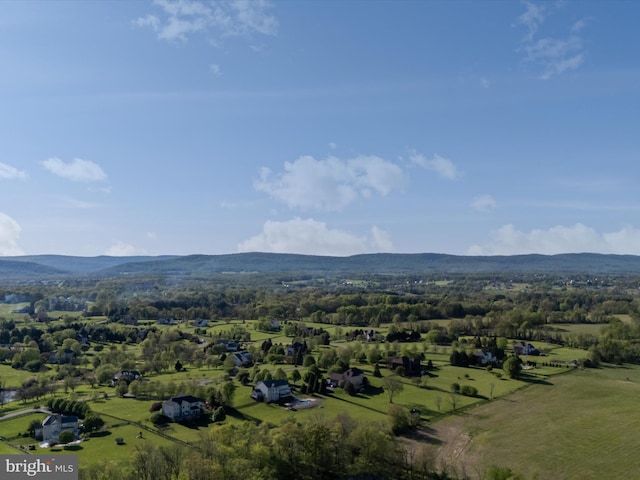 birds eye view of property with a mountain view