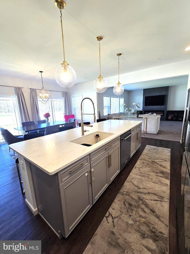 101 Saratoga Ct, North East, MD 21901 - kitchen with a sink, dark wood-style flooring, a spacious island, dishwasher, and open floor plan