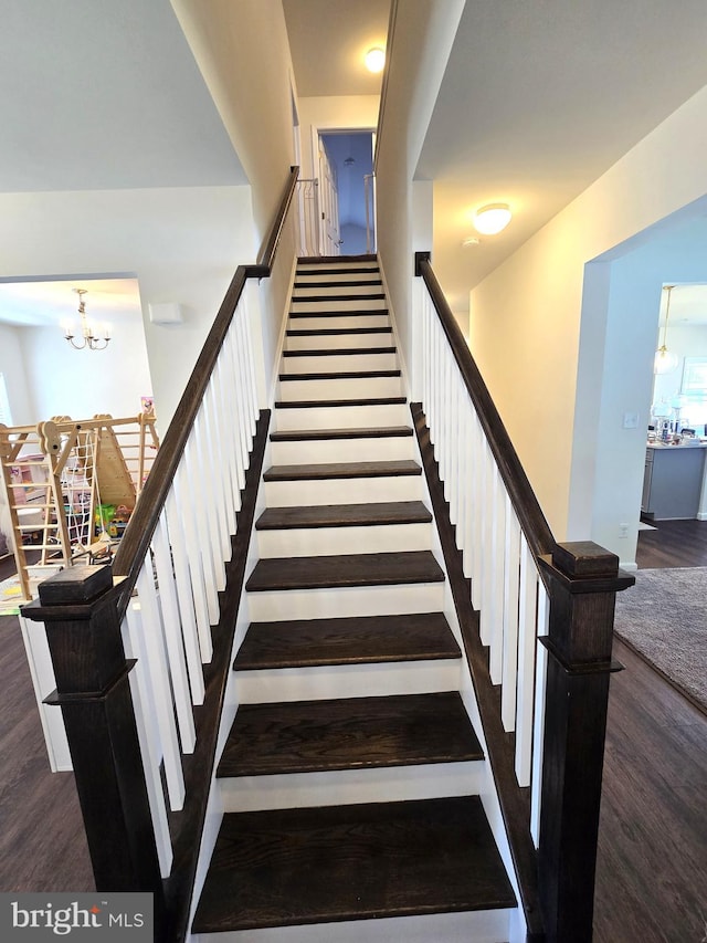 101 Saratoga Ct, North East, MD 21901 - staircase with wood finished floors and a notable chandelier
