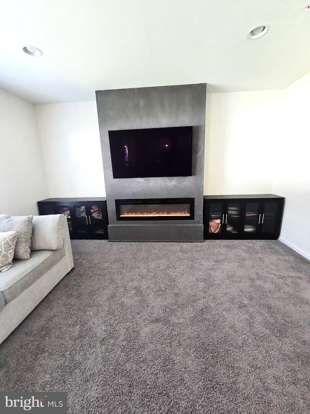 101 Saratoga Ct, North East, MD 21901 - carpeted living room with a fireplace and recessed lighting
