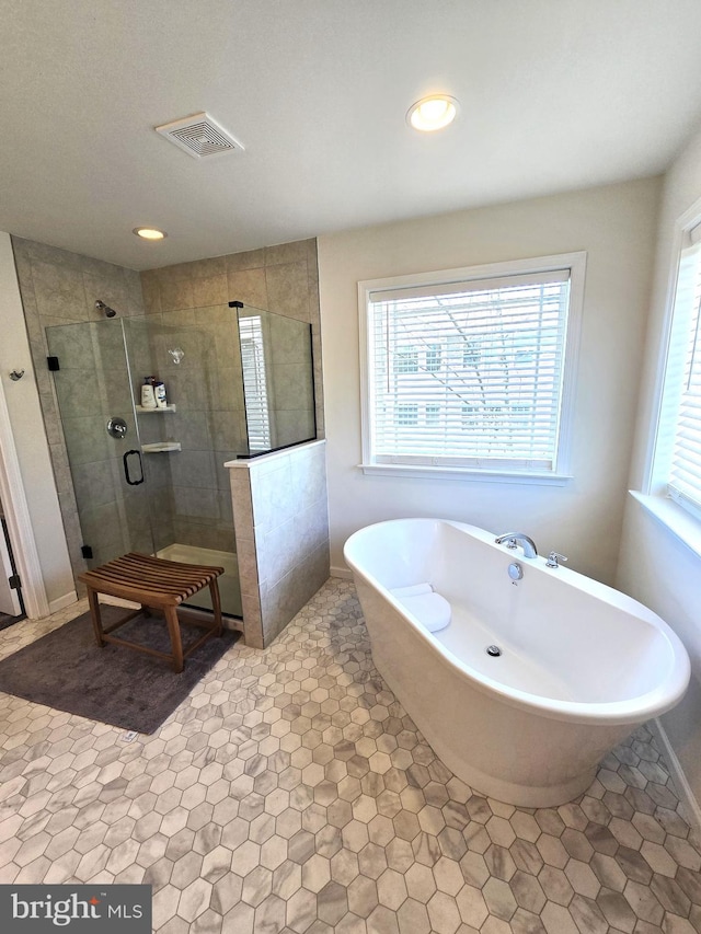 101 Saratoga Ct, North East, MD 21901 - bathroom with a soaking tub, visible vents, a tile shower, and recessed lighting