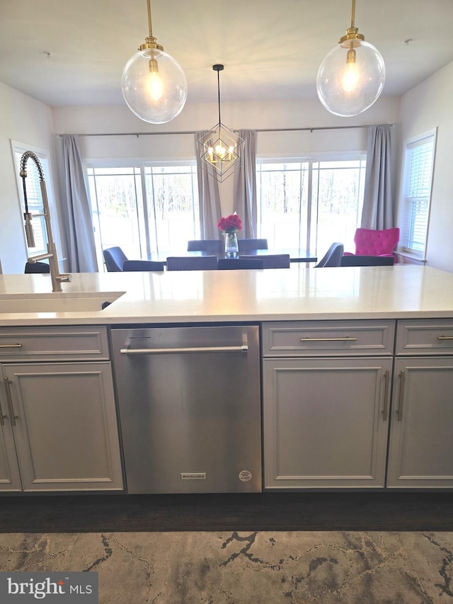 101 Saratoga Ct, North East, MD 21901 - kitchen with stainless steel dishwasher, gray cabinets, a wealth of natural light, and light countertops