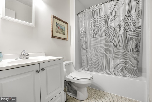 full bath featuring toilet, shower / bath combo with shower curtain, vanity, and tile patterned flooring