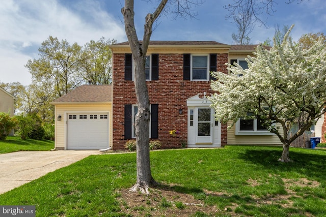 view of front of home with brick siding, a front yard, concrete driveway, and an attached garage