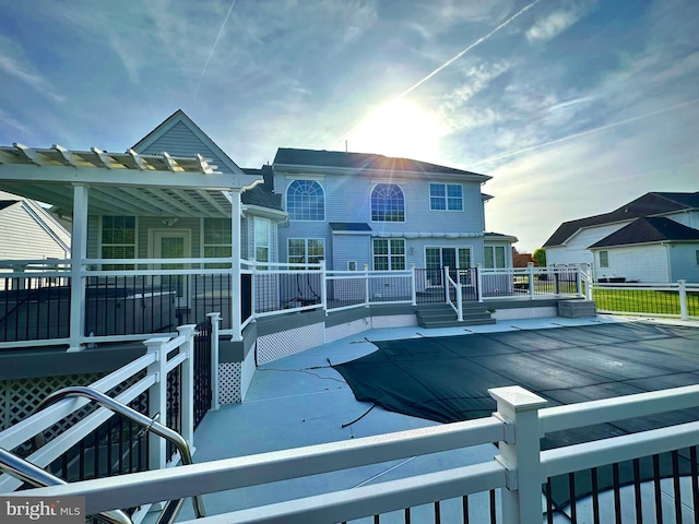 rear view of property with a patio and a deck