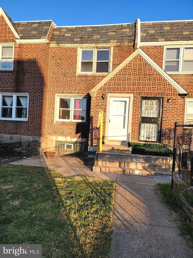 7107 Oakland St, Philadelphia, PA 19149 - exterior space with a front yard, fence, and brick siding