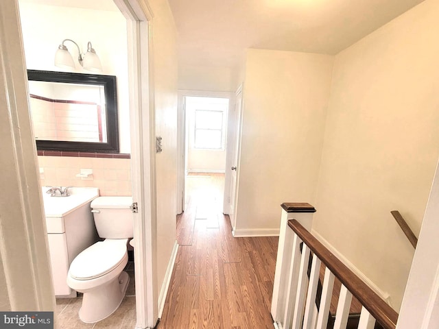 7107 Oakland St, Philadelphia, PA 19149 - half bathroom featuring wood finished floors, toilet, and vanity