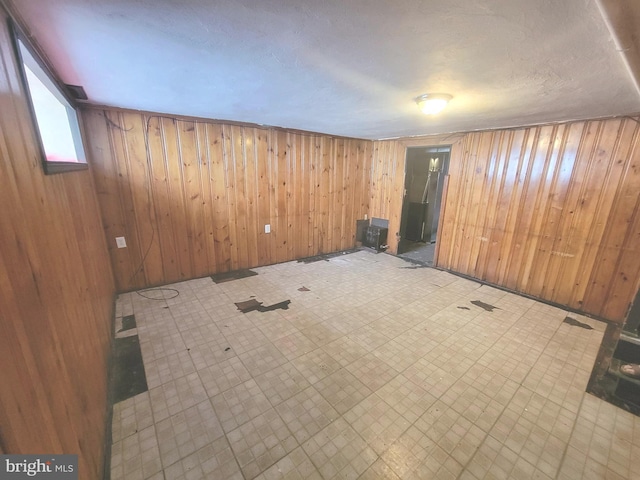 7107 Oakland St, Philadelphia, PA 19149 - spare room with wood walls and tile patterned floors