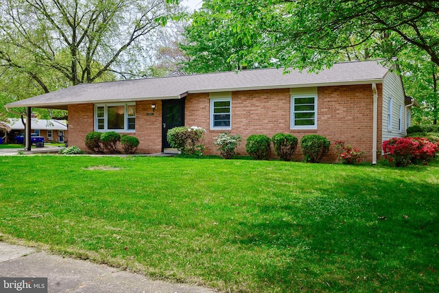1321 Bayshire Ln, Herndon, VA 20170 - ranch-style house with brick siding, a front yard, and roof with shingles