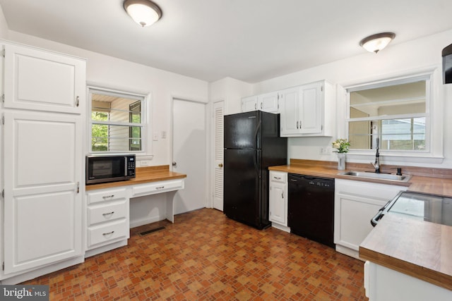 1321 Bayshire Ln, Herndon, VA 20170 - kitchen with black appliances, a sink, white cabinets, and wood counters